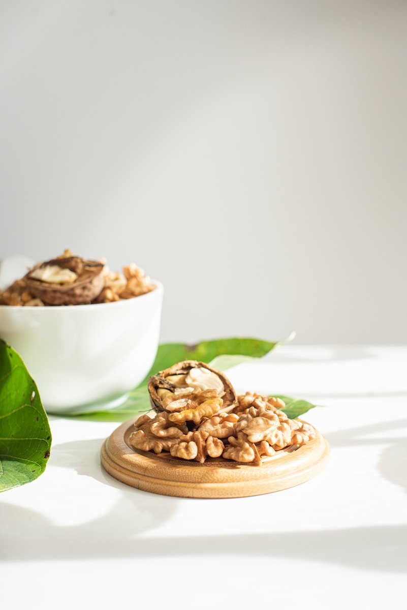 brown nuts on white ceramic bowl